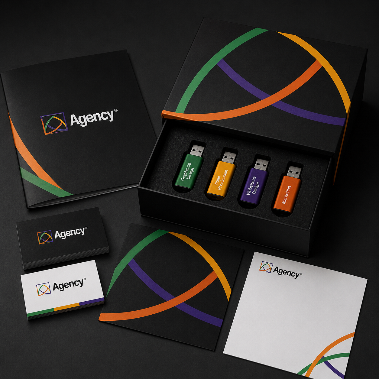 Your Business in a Box display with business cards, branded USB drives, print materials, and Agency Creative Co. packaging